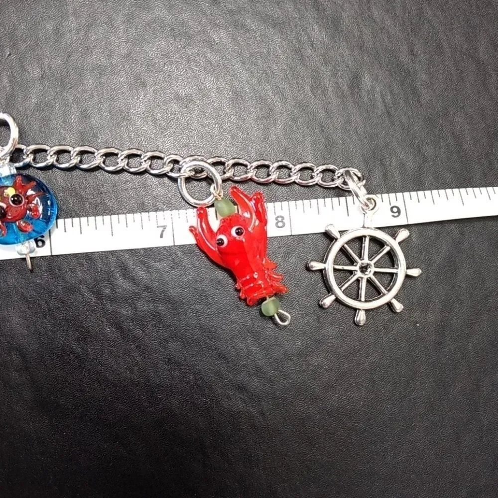Silver tone Under The Sea charm bracelet up to 9